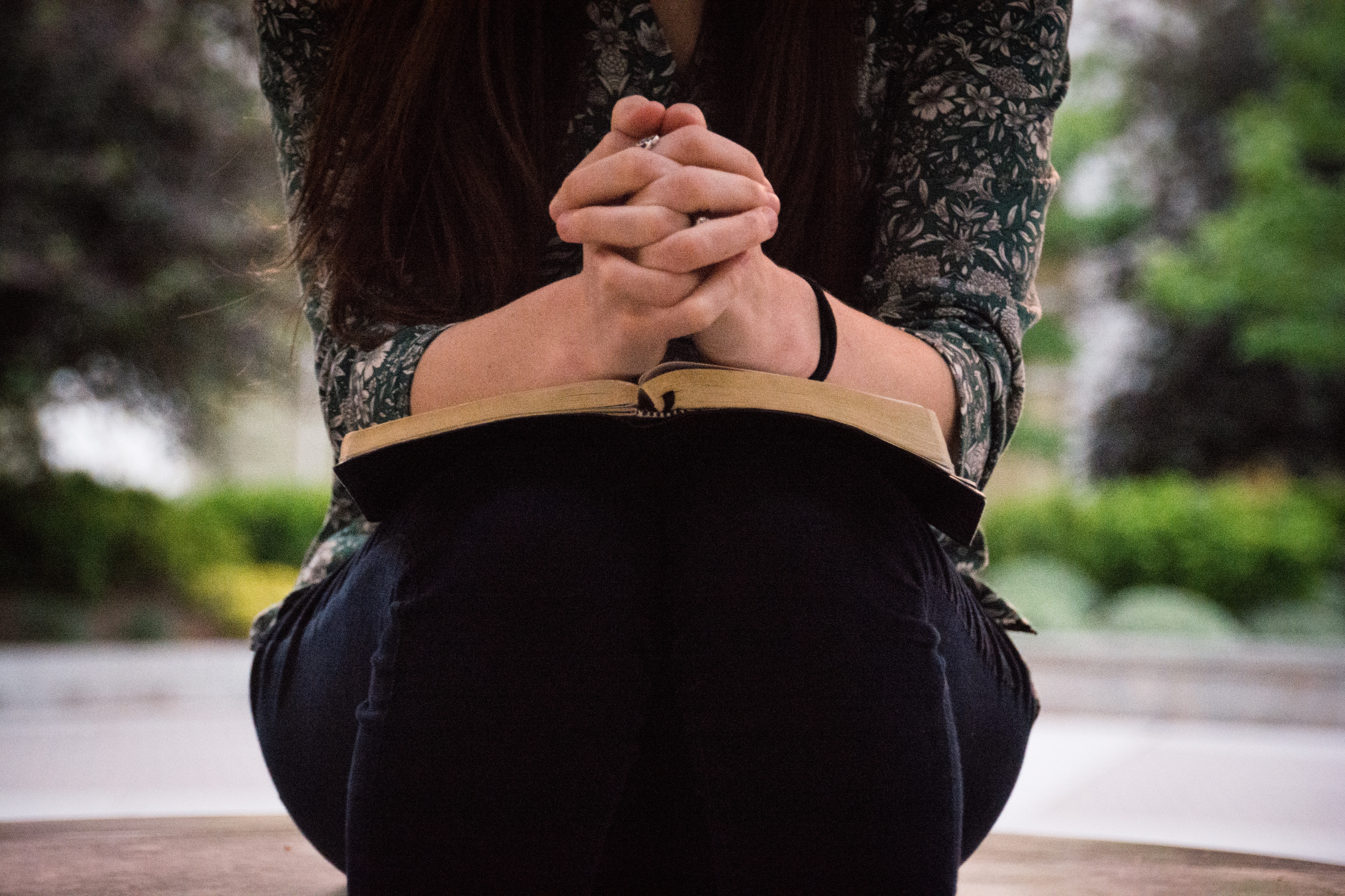 woman praying with Bible
praying for family challenge