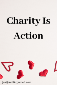 Charity is Action on background with hearts